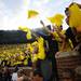 Michigan fans wave yellow pom pons at the start of the first-ever night game at Michigan Stadium on Saturday. Melanie Maxwell I AnnArbor.com
